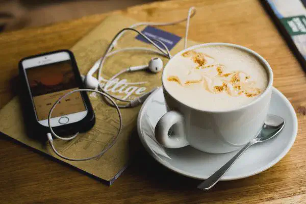 Iphone, earphones and a coffee